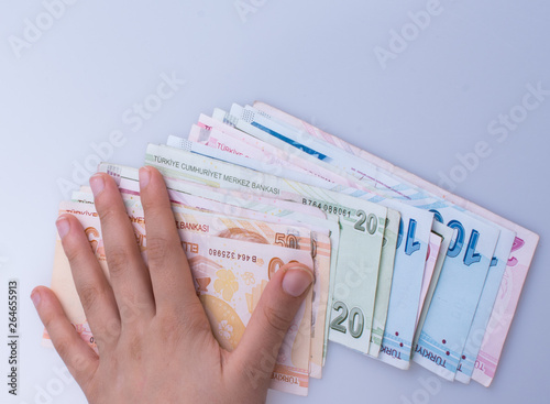 Hand holding Turksh Lira banknotes  in hand photo