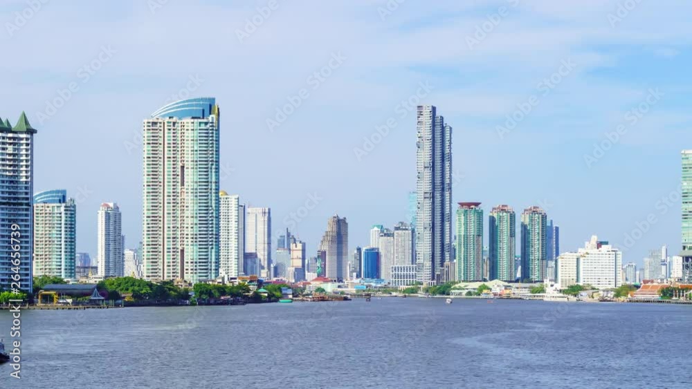 Time lapse: Bangkok waterfront cityscape and Chao Phraya River during sunny day. Zoom out. Time lapse: Bangkok waterfront cityscape and Chao Phraya River during sunny day. Zoom out.