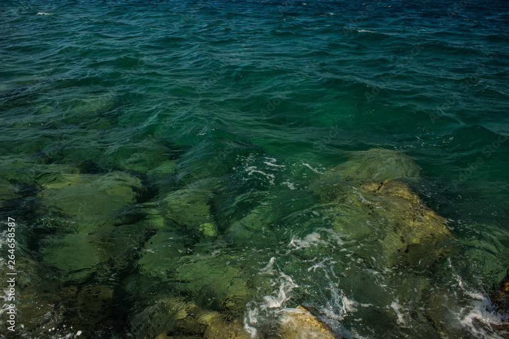 saturated shallow water near coast line of Mediterranean sea background natural view 