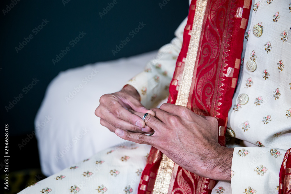 Indian groom's outfit hands, ring and watch