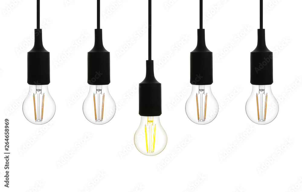 Hanging incandescent light bulb on white background. Modern lamp Hanging incandescent light bulb on white background. Modern lamp