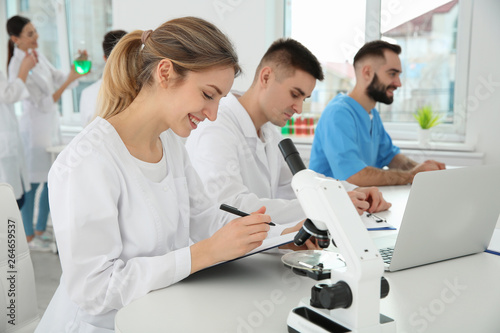 Medical students working in modern scientific laboratory © New Africa