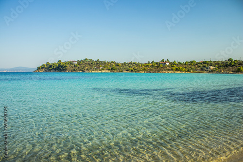 Philippines tropic exotic empty beach picturesque scenery landscape view of transparent soft blue shallow water and opposite forest island waterfront 
