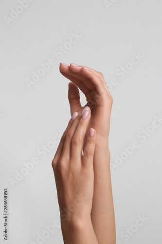 Woman with beautiful hands on light background  closeup. Spa treatment