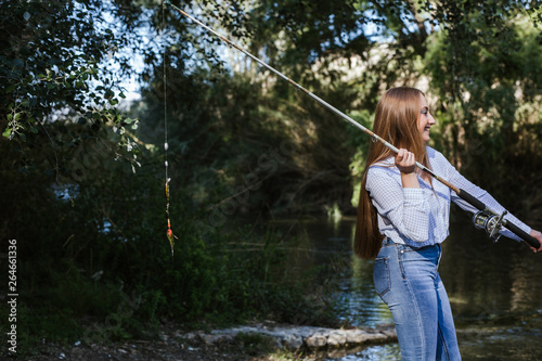 girls fishing in the river with nice style and looks great
