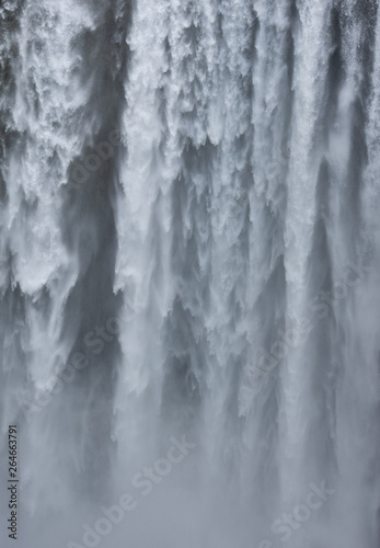 Skógafoss waterfall in Iceland. Skogafoss is powerful and can be a metaphor for force, power, and strength.