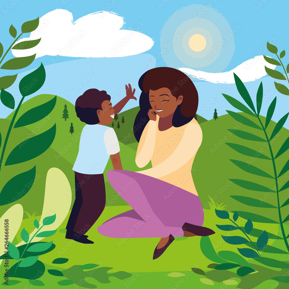 beautiful black mother with son in the field