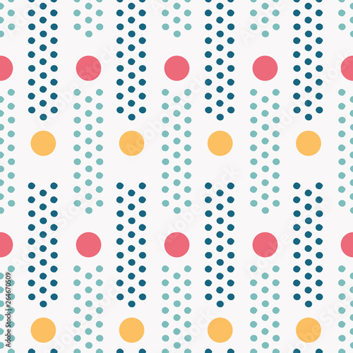 Colorful polka dot seamless pattern with pinpoint dots in columns. Vector. For spring or summer fashion, swimwear, office decor, cards, stationery and textiles. This lively print is so versatile!