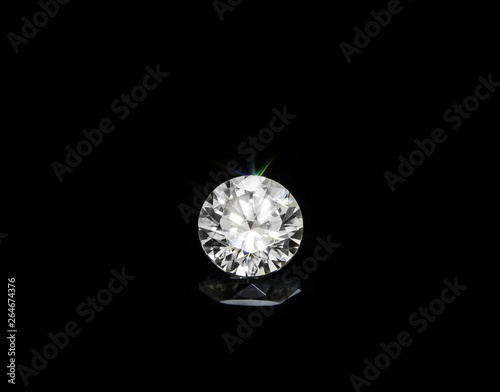 Round diamond Placed on the floor with a beautiful reflection.