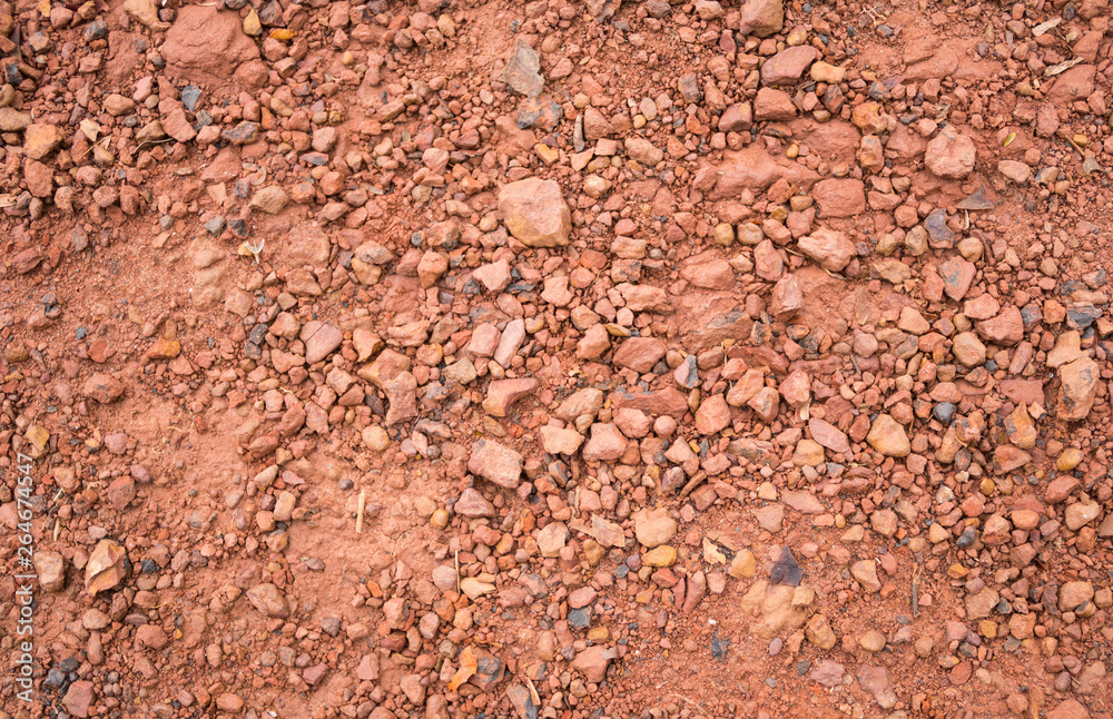 Red Brown Gravel or Soil Texture Background for Design Close up