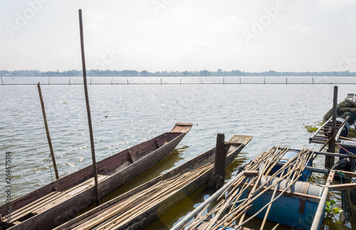 2 Wood Fishing Boat or Rowboat on Swamp with Wood Boat Pole © steafpong