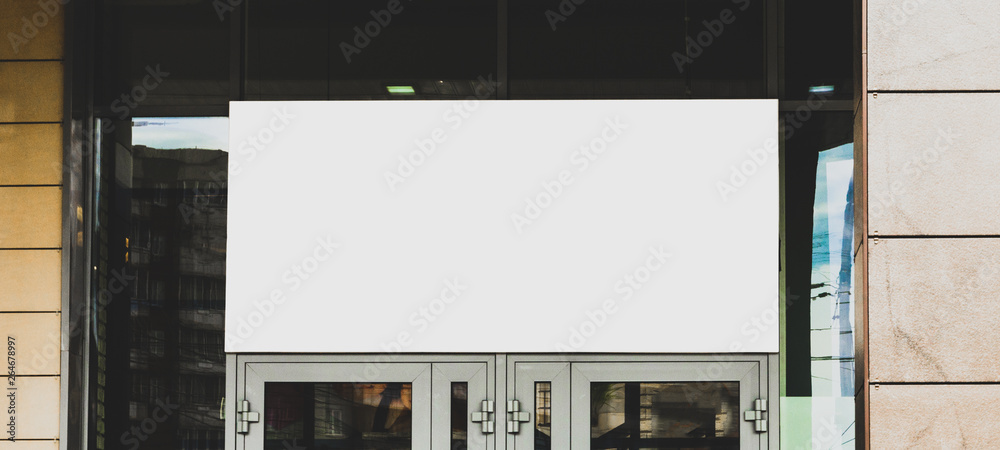 Signboard front view, empty white mock up. Photo blank signboard on the street