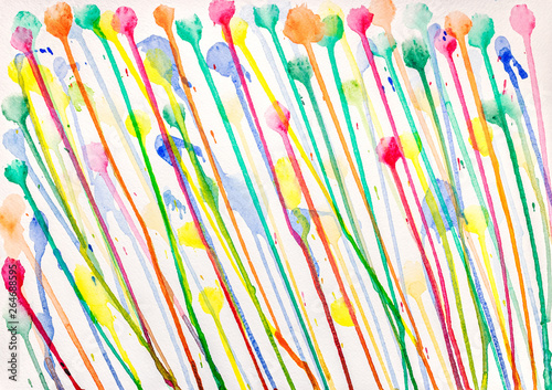 multicolored watercolor paints leaking down on white background