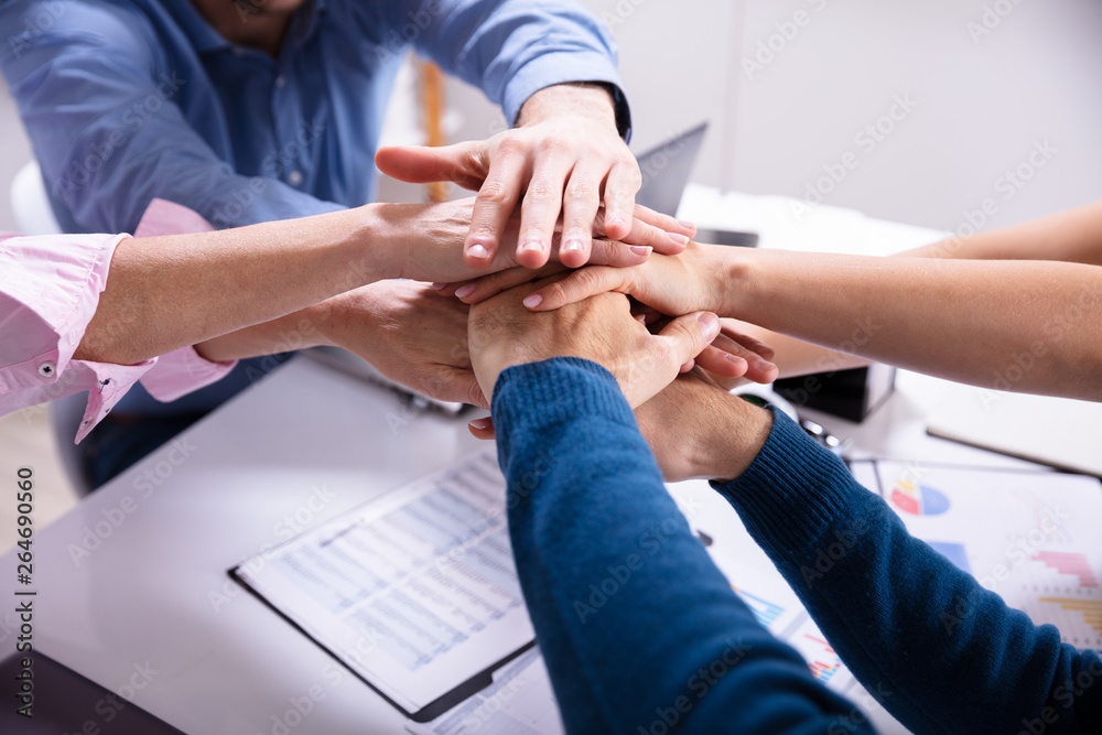 Group Of Businesspeople Stacking Hands