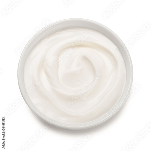 Bowl of  yogurt isolated on white background .