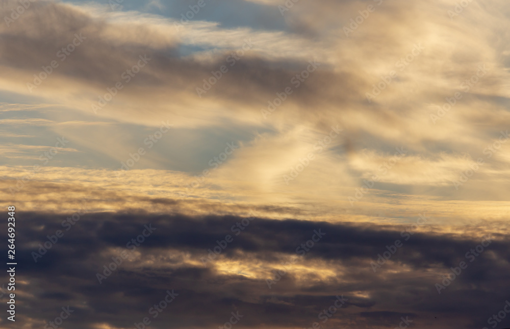 Clouds in the sky at sunset as a background Clouds in the sky at sunset as a background