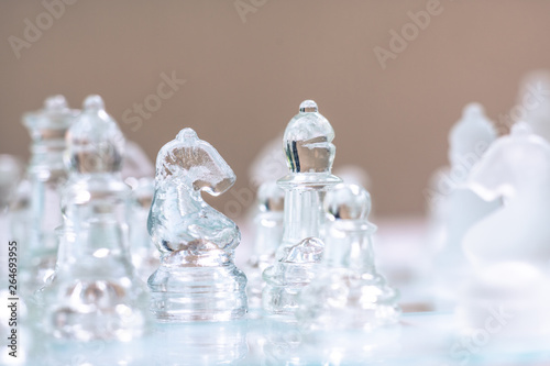 Chess board game made of glass, business competitive concept