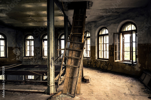 Interior of the old, ruined factory with studio light.