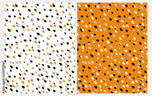 Set of 2 Abstract Seamless Vector Patterns with Hand Drawn Irregular Dots on a White and Orange Background. Black, Gray, White and Orange Geometric Dotted Design. Funny Repeatable Party Layouts. 