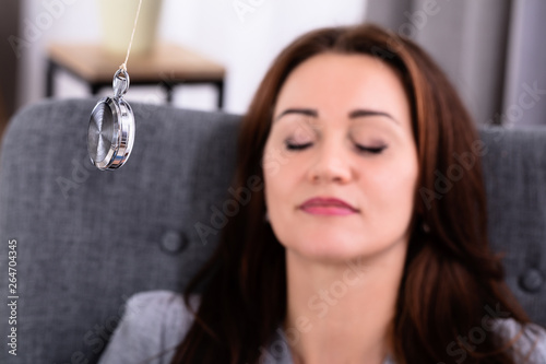 Photos Woman Being Hypnotized While Sitting On Sofa