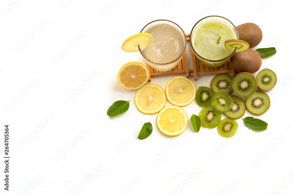 glass of lemon juice with lime and kiwi juice on white background glass of lemon juice with lime and kiwi juice on white background