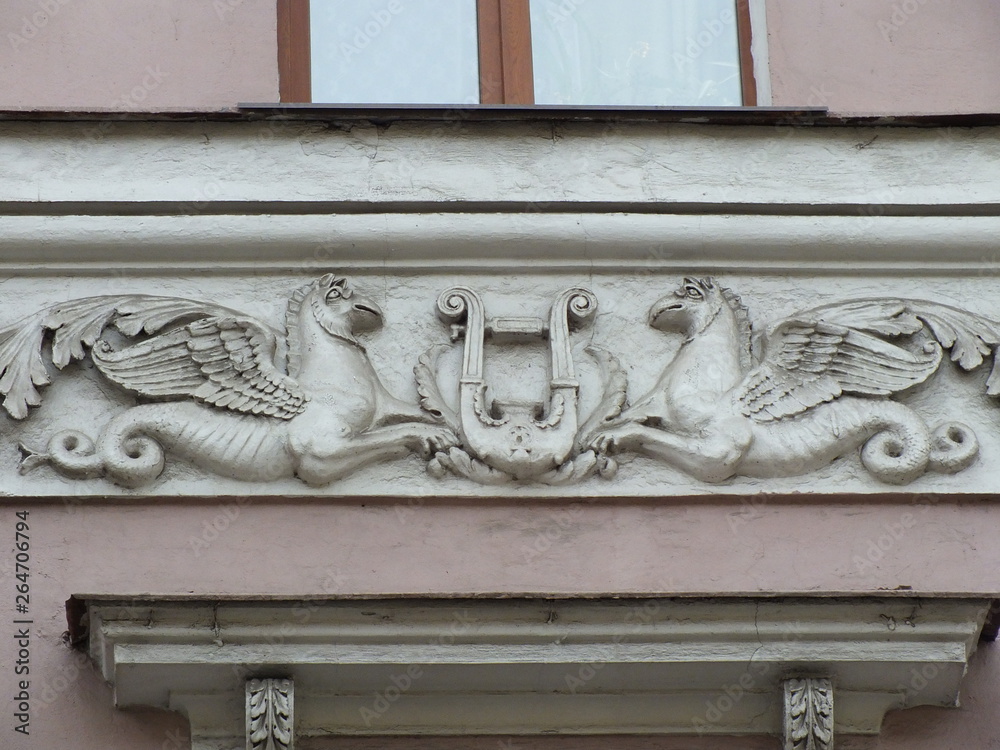 stucco Baroque elements on the facade of the building in St. Petersburg