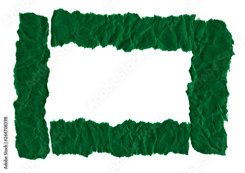 Scraps of dark green paper on a white background. Isolated on white. Ready frame for design, template. Torn paper © ss404045