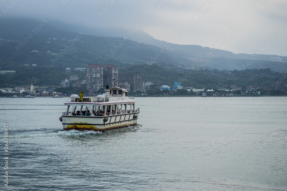 a lonely boat travelling on the lake