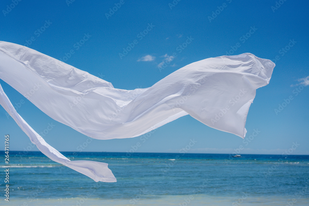 Romantic place by the sea. White fabric curtains fluttering in the wind. Romantic place by the sea. White fabric curtains fluttering in the wind.