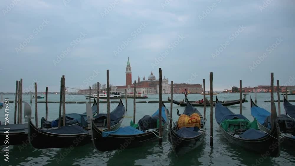 Gondolas moored in Piazza San Marco with San Giorgio Maggiore church in the background Gondolas moored in Piazza San Marco with San Giorgio Maggiore church in the background