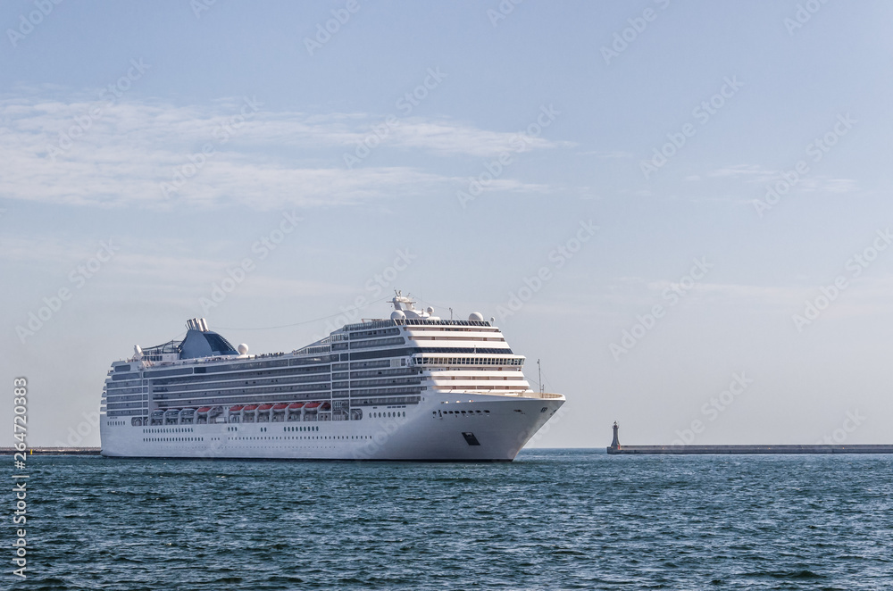 CRUISE SHIP - A beautiful passenger ship maneuvers in the port of Gdynia