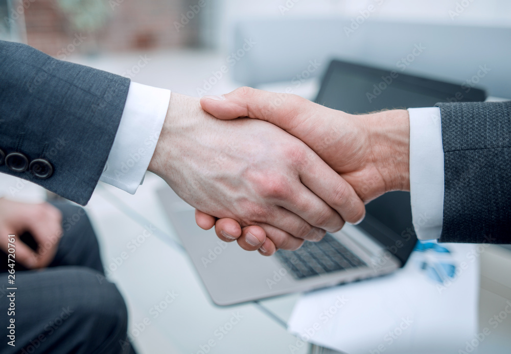 close up. confident handshake of financial partners close up. confident handshake of financial partners