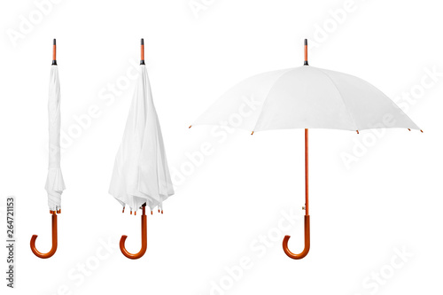 Set of white umbrellas with wooden handle isolated on white background