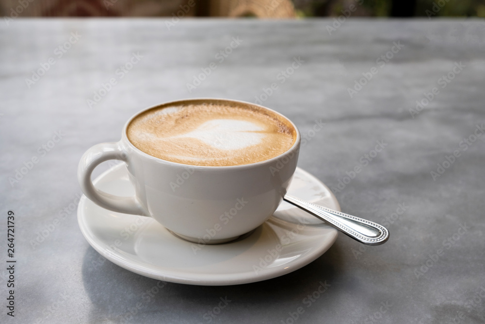 Aromatic latte coffee on the marble table Aromatic latte coffee on the marble table
