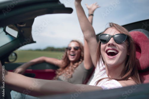 close up. happy woman driving a convertible. © ASDF