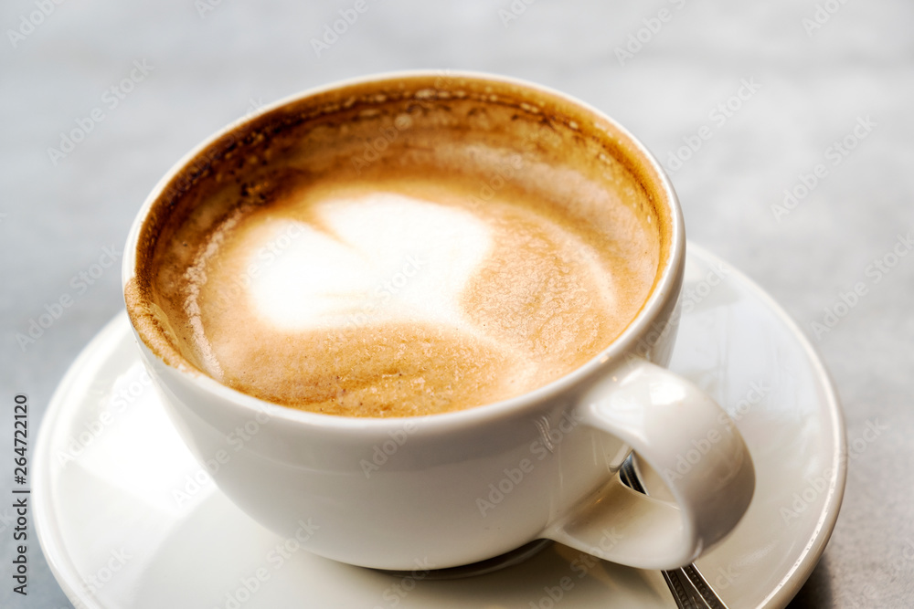 Aromatic latte coffee on the marble table Aromatic latte coffee on the marble table