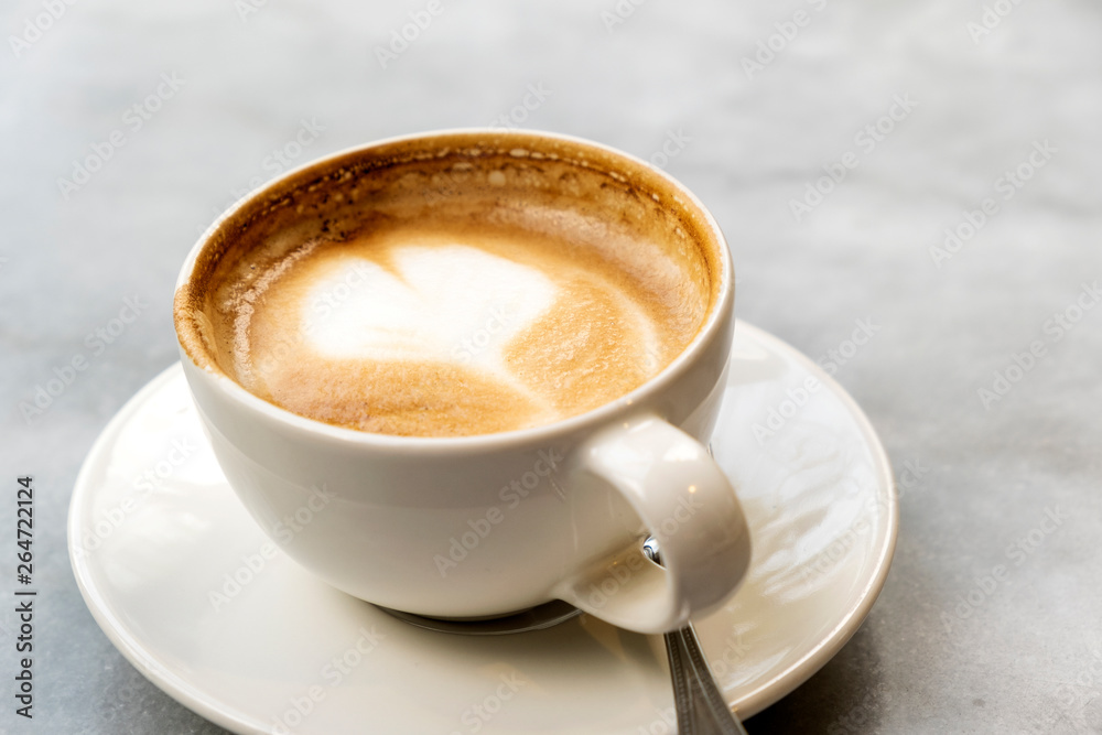 Aromatic latte coffee on the marble table Aromatic latte coffee on the marble table