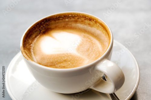 Aromatic latte coffee on the marble table