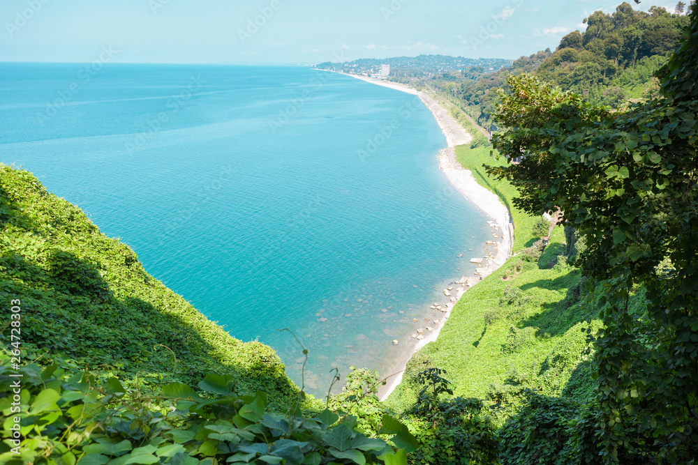 Beautiful view of the Black sea from Botanical garden in Batumi, Georgia. Bright landscape with green-blue water and a lot of greenery on the hills Beautiful view of the Black sea from Botanical garden in Batumi, Georgia. Bright landscape with green-blue water and a lot of greenery on the hills