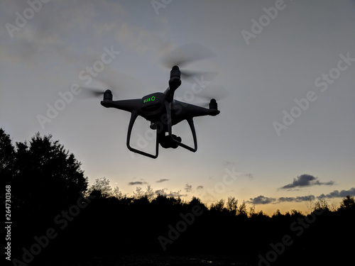 Drone flying at sunrise