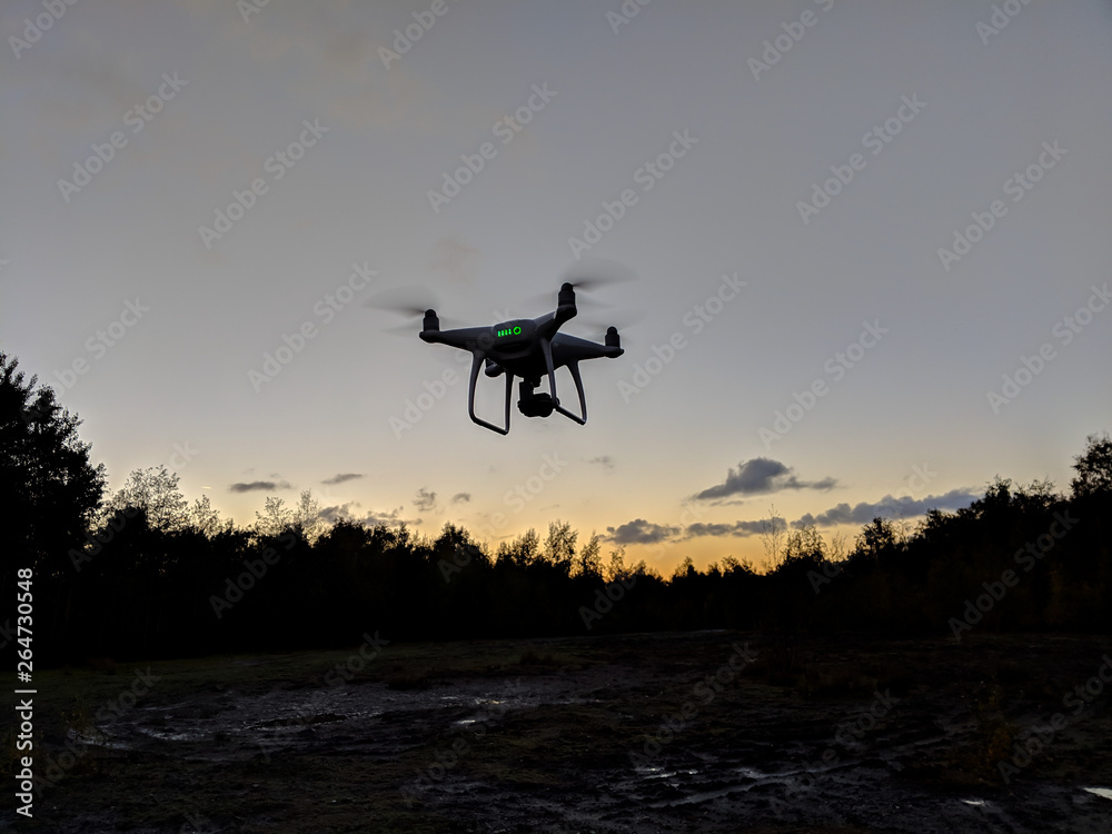 Drone silhouette against sunrise Drone silhouette against sunrise