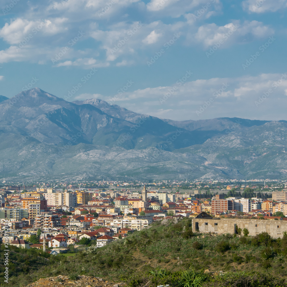 Albanian city Shkoder cityscape with mountain background