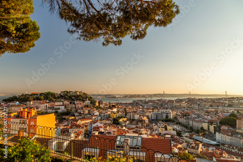 Lisbon cityscape postcard view from the viewpoint Miradouro da Senhora do Monte at sunset. photo