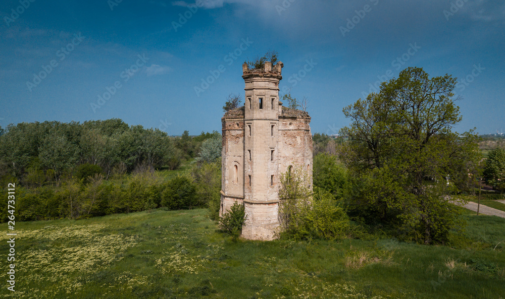 an old abandoned medieval castle in the forest with a beautiful sky