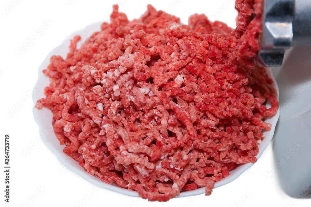fresh minced meat with meat grinder on white background fresh minced meat with meat grinder on white background