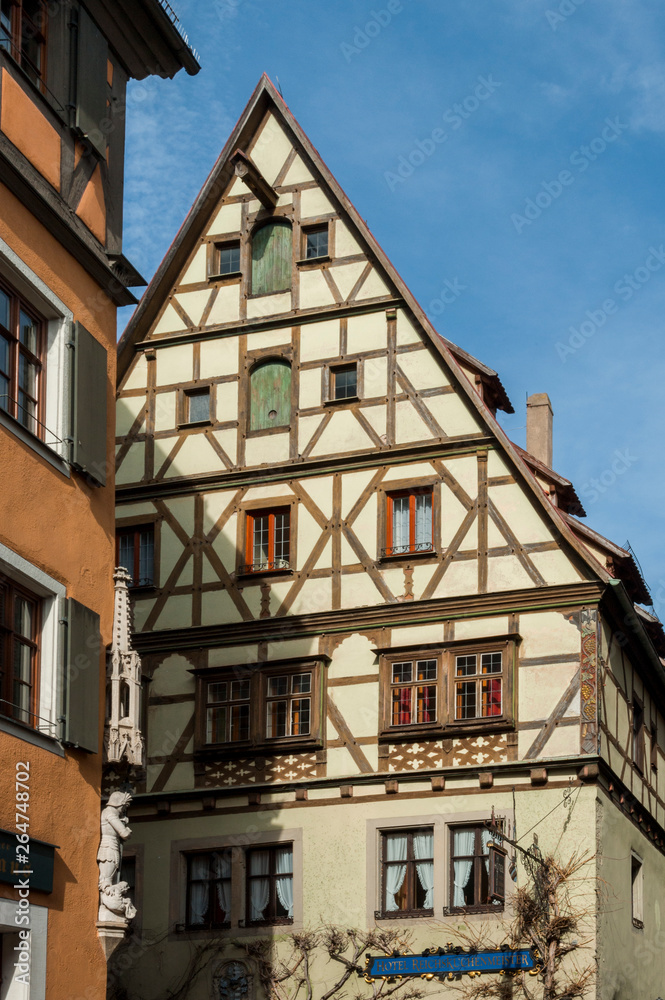 Fototapeta premium ROTHENBURG OB DER TAUBER, GERMANY - MARCH 05, 2018: Historic colorful half-timbered houses in the medieval town Rothenburg ob der Tauber, one of the most beautiful villages in Europe, Germany