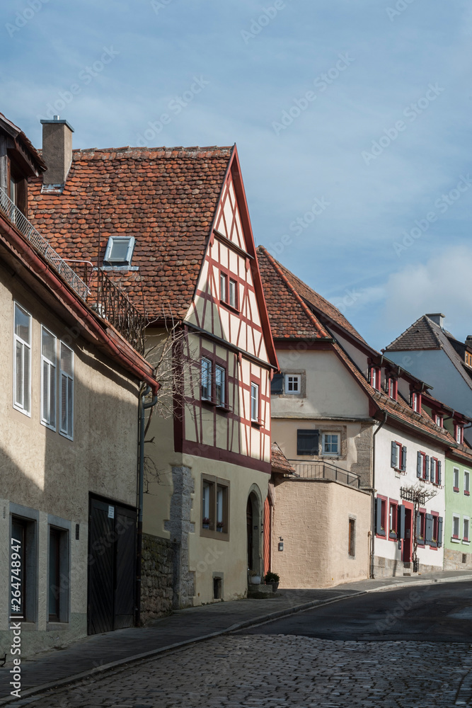 ROTHENBURG OB DER TAUBER, GERMANY -  MARCH 05, 2018: Historic colorful half-timbered houses in the medieval town Rothenburg ob der Tauber, one of the most beautiful villages in Europe, Germany