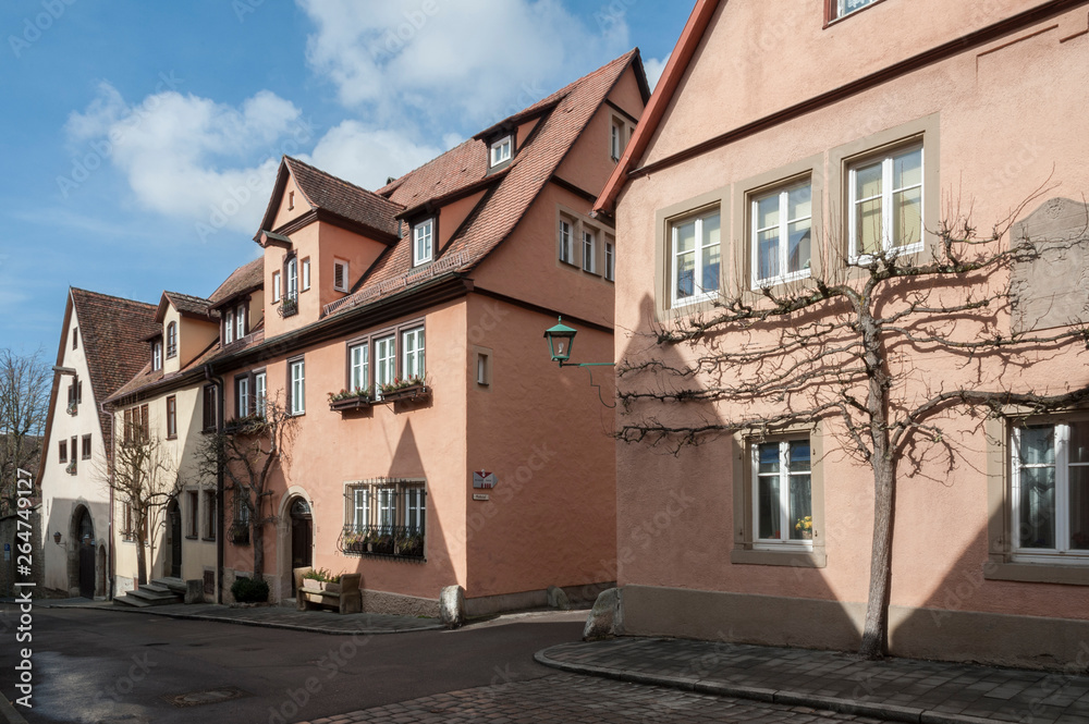 ROTHENBURG OB DER TAUBER, GERMANY -  MARCH 05, 2018: Historic colorful half-timbered houses in the medieval town Rothenburg ob der Tauber, one of the most beautiful villages in Europe, Germany