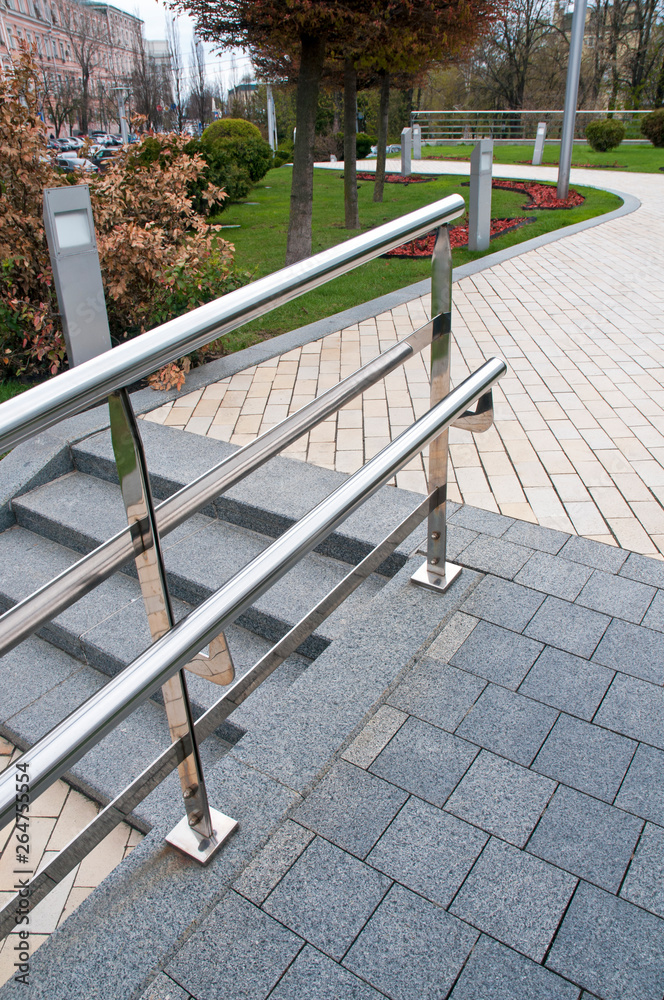 railing and pavement in recreation areas and near architectural buildings