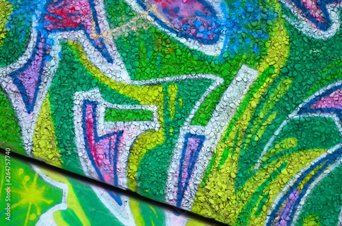 Fragment of colored street art graffiti paintings with contours and shading close up photo